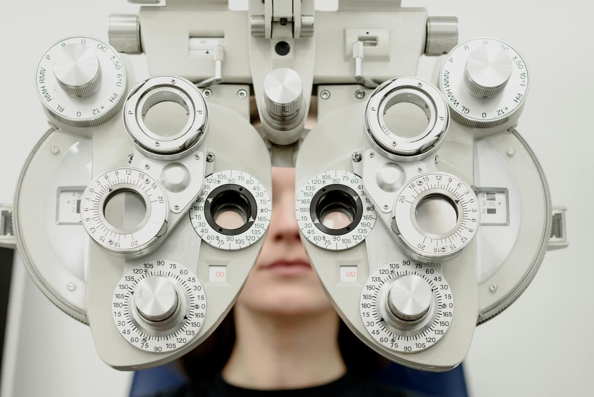 Man touching his eye during cataract evaluation