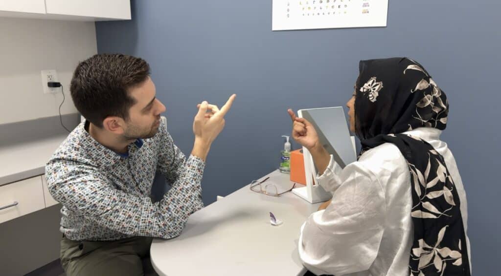 Dr. Sami teaching contact lens insertion